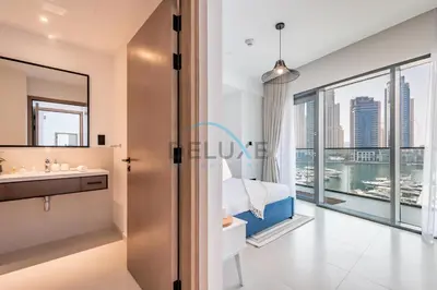a bedroom with a view of the city at Modern 2BR in VIDA Residences Dubai Marina by Deluxe Holiday Homes in Dubai