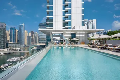 a swimming pool with a view of a building at Modern 2BR in VIDA Residences Dubai Marina by Deluxe Holiday Homes in Dubai