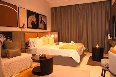 a hotel room with a bed and a couch at kinda Holiday Homes- Mag 318 Downtown in Dubai