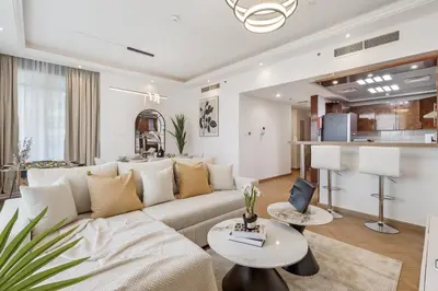 a living room with a couch and a table at Elegant 3BR Lux Stay in the Heart of Dubai Marina in Dubai