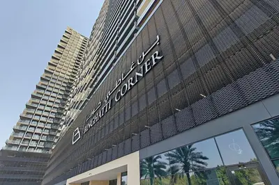 a sign on the side of a building at Vogue JVC Binghatti Corner near Circle Mall, One Bedroom Apartment with Balcony and City View, Access to all Amenities in Dubai