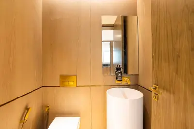 a bathroom with a toilet and a mirror at Palm Haven Luxe 3 Bed Townhouse with Private Pool in Dubai