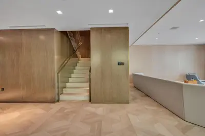 a lobby with a staircase and a stair case at Palm Haven Luxe 3 Bed Townhouse with Private Pool in Dubai