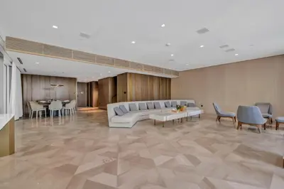 a lobby with a couch and chairs and a table at Palm Haven Luxe 3 Bed Townhouse with Private Pool in Dubai