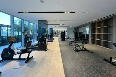 a gym with treadmills and exercise equipment in a building at Elegant Retreat with Stunning Burj Khalifa Views in Dubai