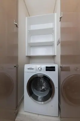 a washer and dryer in a bathroom with a washing machine at Cozy 1BR with balcony great view, Damac Towers in Dubai