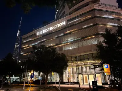 a building with a sign on the side of it at Luxury 3BR Burj Khalifa View Infinity Pool Spa Gym in Dubai