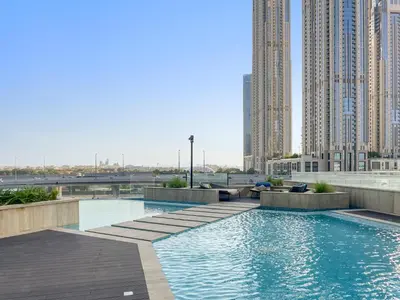 a swimming pool in a city with tall buildings at ALiving Elegant 1BR I Near Burj Khalifa & Dubai Mall I Missoni Tower- 607 in Dubai