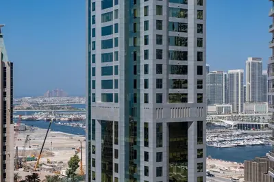 a view of a tall building in a city at Modern studio near the beach in Dubai