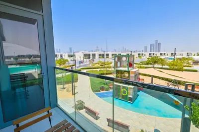 a balcony with a view of a swimming pool at Amazing 1 Bedroom in District One Meydan in Dubai