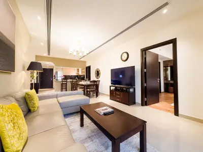 a living room with a couch and a table at Prime 2BR with Burj Khalifa & Dubai Canal View - 20AB16 in Dubai
