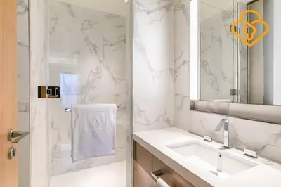 a white bathroom with a sink and a mirror at Keysplease Address Opera 2BR Downtown 26 in Dubai