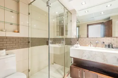 a bathroom with a glass shower and a sink at Elegant 2BR in Park Island Bonaire, Dubai Marina by Deluxe Holiday Homes in Dubai