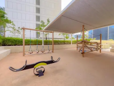 a playground with swings and a monkey swing at Exclusive Burj Khalifa View - Modern 1 BR in Dubai