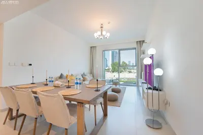 a dining room with a table and chairs at Downtown Views Tower 2 brand new apt in Dubai