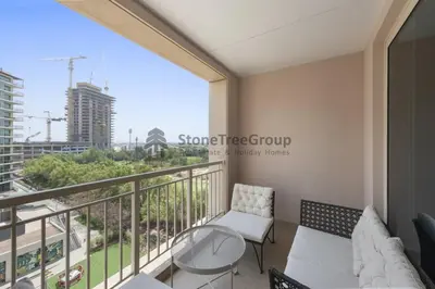 a balcony with a view of the city at Stylish 1 Br In Unique Location in Dubai