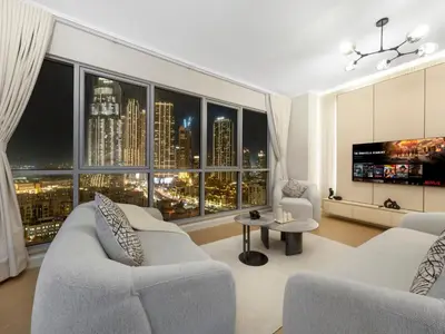 a living room with two couches and a large window at Burj Khalifa & Fountain Show Views 4 BHK In Downtown, 2 minutes walk to Dubai Mall in Dubai