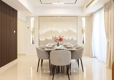 a dining room with a table and chairs at Coastal Marina Escape - 4 BR Sea, Dubai Eye & Palm View in Dubai