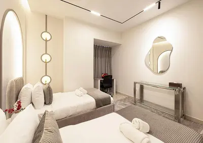 a hotel room with two beds and a mirror at Coastal Marina Escape - 4 BR Sea, Dubai Eye & Palm View in Dubai