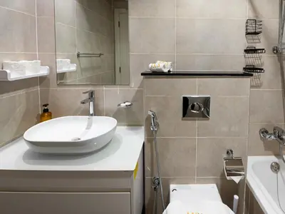 a bathroom with a sink and a toilet at Cozy and Stylish Studio Retreat in DAMAC Hills in Dubai