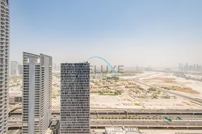 an aerial view of a city with tall buildings at Lovely 2BR at The Signature, Downtown Dubai by Deluxe Holiday Homes in Dubai