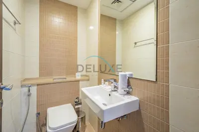 a bathroom with a sink and a toilet at Stunning 1BR Apartment at Botanica Tower 1, Dubai Marina by Deluxe Holiday Homes in Dubai