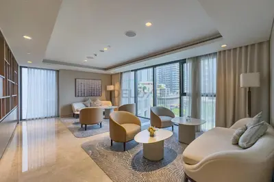 a hotel lobby with chairs and a living room at Magnificent 2BR Apartment at Act One Act Two Tower 2 in Downtown Dubai by Deluxe Holiday Homes in Dubai