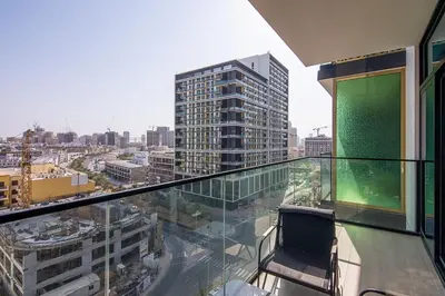 a balcony in a building with a view of a city at Binghatti Emerald, JVC- Charming 1-BR Apartment in Dubai
