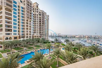 an aerial view of a resort with a marina at Chic 2BR Apartment with Pool View in Marina Apartment 6, Palm Jumeirah by Deluxe Holiday Homes in Dubai