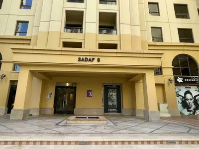 a building with the entrance to a building with a show at Luxury 4 Bed Apartment in Sadaf 8 on The Walk JBR in Dubai