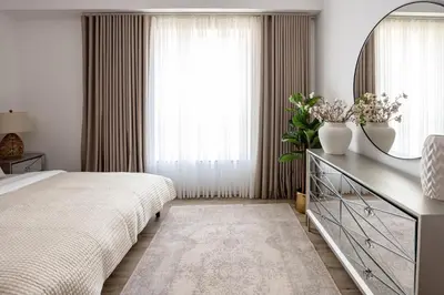 a bedroom with a bed and a large window at Beautiful and bright 1 bedroom apartment! Sofia ! in Dubai