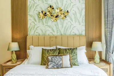 a bedroom with a large white bed with two lamps at Chic 1BR Marina View Retreat in Dubai