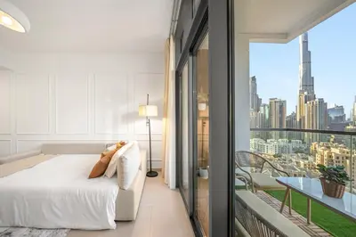 a bedroom with a bed and a view of the city at Bellevue Towers by Luxe Living - Full Burj Khalifa View in Dubai