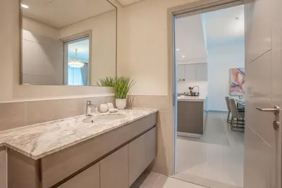 a bathroom with a sink and a mirror at NewArabian Forte Downtown in Dubai