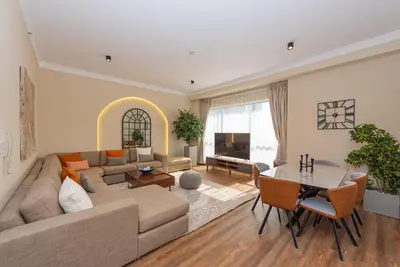 a living room with a couch and a table at Rimal 4, JBR- Elegant 2 BR in Dubai