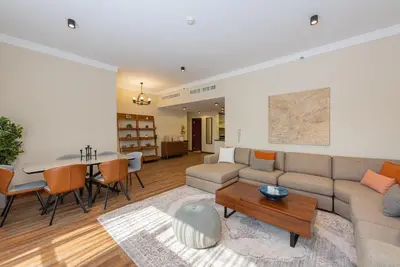 a living room with a couch and a table at Rimal 4, JBR- Elegant 2 BR in Dubai