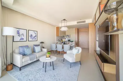 a living room with a couch and a table at Frank Porter - The Address Opera Residences in Dubai