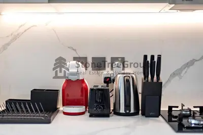 a kitchen counter with many different types of appliances at Luxury Studio Near To Metro in Dubai