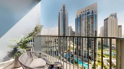 a balcony with a view of a city at Creek Edge - One Bedroom with Partial Sea View in Dubai