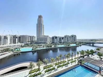 a view of a city with a river and buildings at Palace Residence - Chic Two Bed with Creek View in Dubai