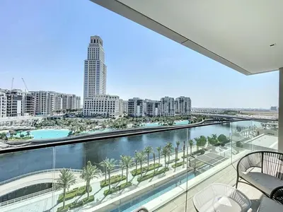 a view of a city from the balcony of a building at Palace Residence - Chic Two Bed with Creek View in Dubai