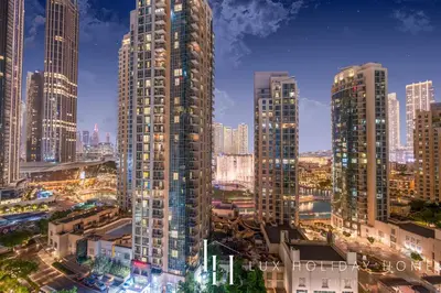 a view of a city with tall buildings at LUX The Fountain View Suite in Dubai