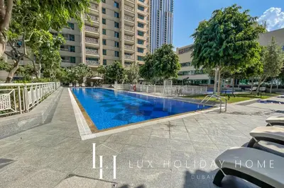 a swimming pool in the middle of a building at LUX The Fountain View Suite in Dubai