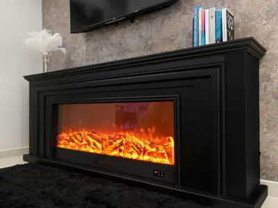 a fireplace with a fire inside of it at Stunning 2BR with Burj View & Infinity Pool in Dubai