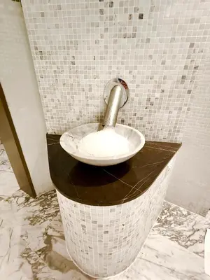 a bathroom with a sink with a faucet at Stunning 2BR with Burj View & Infinity Pool in Dubai