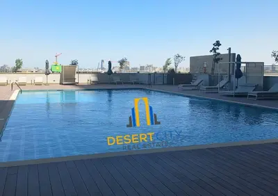 a large swimming pool with a resort sign on it at Fully Furnished 2 Bed in Sobha Creek Vista Reserve, Hosted by Desert City Stays in Dubai
