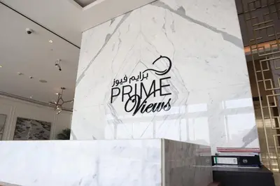 a white marble wall with a sign on it at VIP Experience Dubai Nad Al Sheba at Prime Views- Opposite Al Meydan Hotel- Modern Luxury Apartment in Dubai
