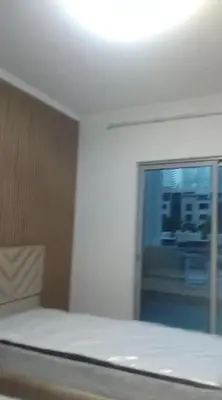 a bedroom with a bed and a window with a view at 3 bedroom Villa Downtown in Dubai