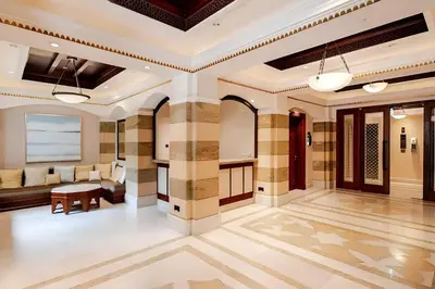 a large room with a lobby with a couch and a table at 804 Yansoon 5 Amazing 1BR Apt Downtown Dubai in Dubai