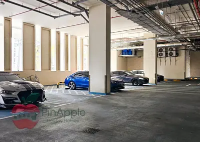 a group of cars parked in a parking lot at 1BR With Burj Khalifa View and Accomodates 4 People in Dubai